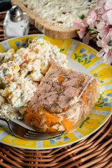 Jellied pork and beef with carrots served with vegetables salad