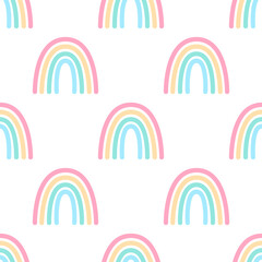 Seamless pattern with colorful cartoon rainbows