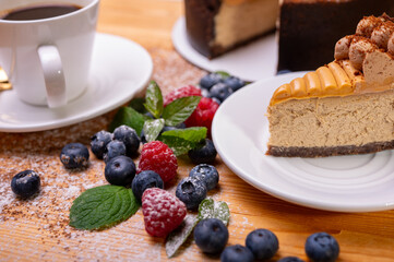 close-up of cheesecake with cream filling, decorated with fresh berries, blueberries and raspberries, festive New Year's cake, Christmas. From above