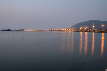 Sunset view of costal street of town of Lefkada, Greece