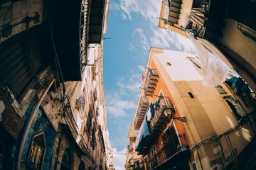 Tuinposter Street view in Palermo. Traditional old houses against blue sunny sky. © Yurii Zymovin