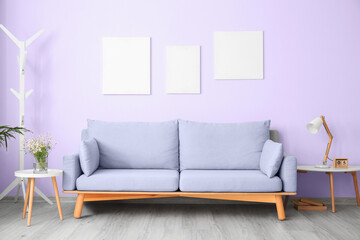 Interior of modern living room with comfortable lilac sofa