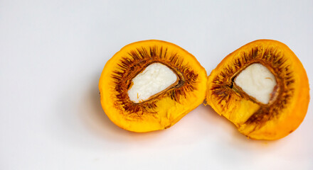 Ripe Pequi fruit (Caryocar brasiliense), showing the dangerous thorns in detail inside the ripe fruit. Dangerous food fruit