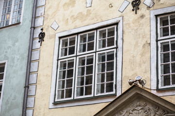Beautiful modernist windows with more art nouveau in an old building facade in Riga, Latvia