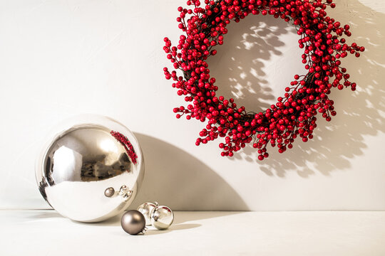 Holiday red berry wreath with silver ball and ornaments