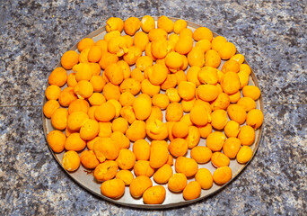 Ripe Pequi fruit (Caryocar brasiliense), wild fruits typical of the Brazilian cerrado biome.