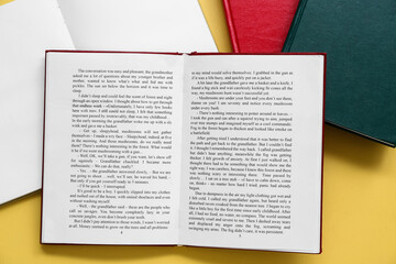 Open books on yellow background