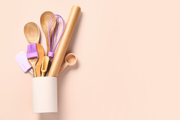 Baking utensils on beige background