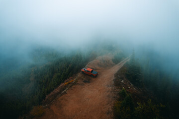 Travel concept. Off road truck on top of high altitude mountain trail, Snoqualmie Pass, Washington...
