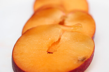 Sliced ​​plum. plum pieces. plums ready for consumption. plum slices with selective focus.