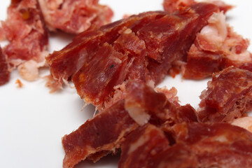 salami cut for consumption. salami details. salami with selective focus.