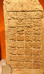 Mayan bas-relief stele and glyphs