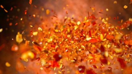 Freeze Motion Shot of Flying Dry Chilli Peppers, Macro