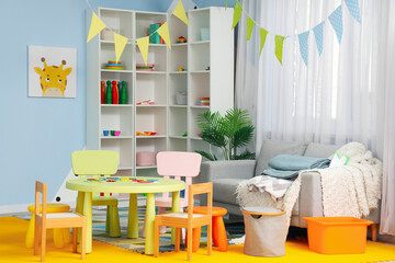 Interior of playroom in kindergarten with toys - obrazy, fototapety, plakaty