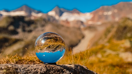 Crystal ball alpine summer landscape shot at Lake Egesensee near Dresdnerhuette, Mutterbergalm,...