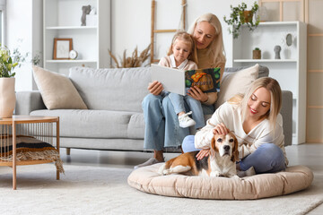 Happy family with cute dog at home