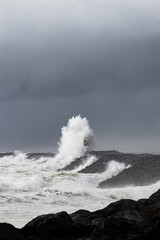Wave Crashing on the Rocky Beach