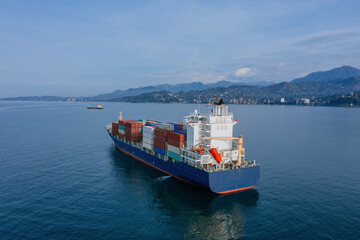 Cargo ship with containers near Batumi, aerial drone view