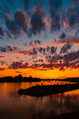 Fototapeta premium Sunset with a dramatic sky and reflections near Deggendorf, Danube, Bavaria, Germany