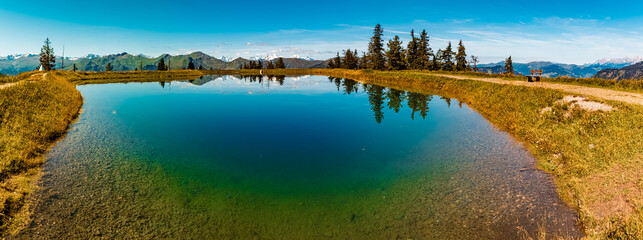 High resolution stitched alpine summer panorama with reflections at Lake Spiegelsee, Mount Fulseck,...