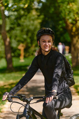 In the radiant embrace of a sunny day, a modern woman revels in the joy of cycling, her sleek...