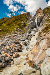 Alpine summer view with a mountain stream near Dresdnerhuette, Mutterbergalm, Stubaital valley, Innsbruck, Tyrol, Austria