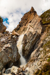 Alpine summer view with a mountain stream near Dresdnerhuette, Mutterbergalm, Stubaital valley, Innsbruck, Tyrol, Austria