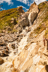 Fototapeta na wymiar Alpine summer view with a mountain stream near Dresdnerhuette, Mutterbergalm, Stubaital valley, Innsbruck, Tyrol, Austria