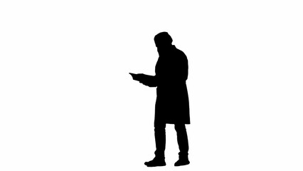 Portrait of man medic in studio isolated on white background alpha channel. Senior doctor silhouette in uniform walking and reading paper documents.