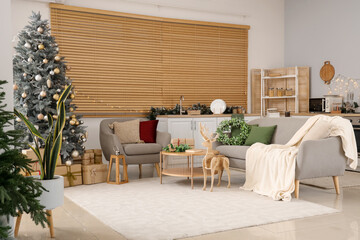 Interior of festive open space kitchen with Christmas decorations