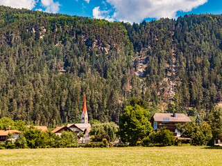 Alpine summer view with a church near Saint Sigmund, San Sigismondo, Trentino, South Tyrol, Italy