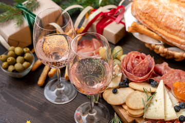 festive aperitif or party two glasses of champagne, Prosecco or rosé wine with cold meat...
