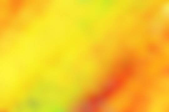 Abstract blurred background image of red, yellow colors gradient used as an illustration. Designing posters or advertisements.