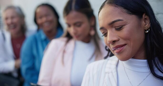 Waiting, recruitment and business women in queue for hiring, career opportunity or interview. Group, hr line or happy professional people job hunting, onboarding or phone call on tech by wall in city