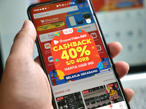 Tenggarong, November, 2023. browsing to shopee shop on phone, e-commerce social media commerce