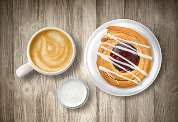 Cherry pastry and cafe latte with cream on wood table top at a cafe