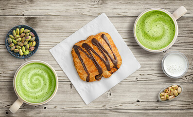 Sharing a pastry with matcha lattes on table top at a cafe