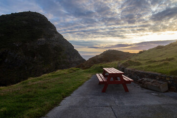 Picnic bench on the Cape Brett Hike, Northland, New Zealand - Powered by Adobe