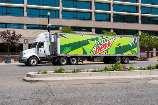 A Mtn Dew truck on the street in Salt Lake City, Utah, USA,  on May 11, 2023. Mountain Dew, stylized as Mtn Dew in some countries, is a carbonated soft drink brand produced and owned by PepsiCo.