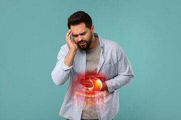 Man suffering from stomach ache on light blue background. Illustration of unhealthy...