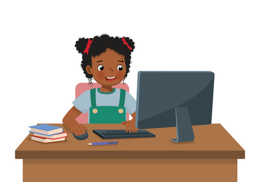 Cute little African girl student study using Computer PC at the desk