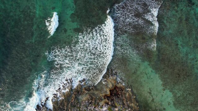Aerial view of waves crashing in Akumal, Mexico