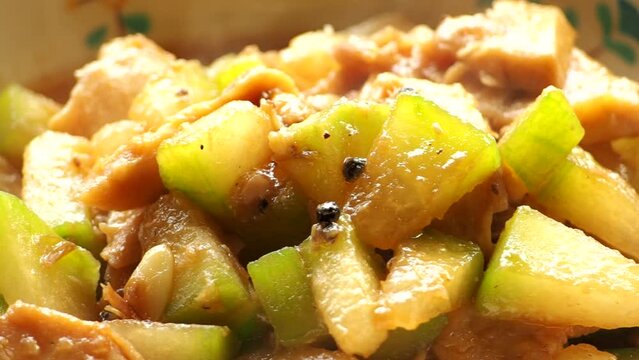Fried wax gourd with chopped breast chicken in bowl, in door  Chiangmai  Thailand.