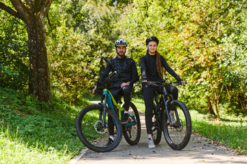 Fototapeta premium A blissful couple, adorned in professional cycling gear, enjoys a romantic bicycle ride through a park, surrounded by modern natural attractions, radiating love and happiness