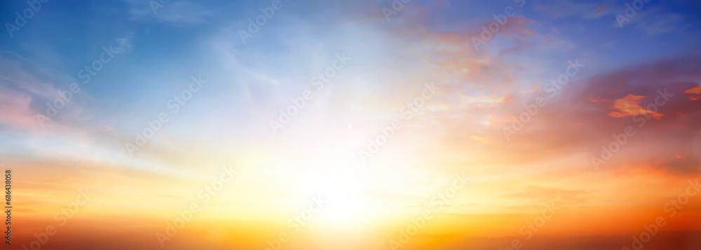 Wall mural beautiful orange sunset sunrise with clouds sky in nature.