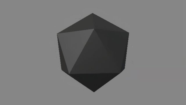 A black polyhedron floating against a gray background exhibits geometric beauty and simple design, reminiscent of the basics of 3D modeling.
