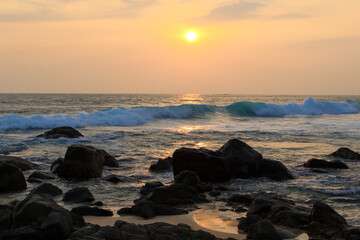 Unawatuna beach in Sri Lanka. Waves crashing on the rocks