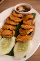 Fried Vietnamese pork sausage on banana leaf. Asian food concept food appetizer in Thai called Moo Yor