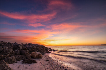 Beautiful vibrant sunset at Little Hickory Island Beach Park Bonita Springs, Florida - obrazy, fototapety, plakaty