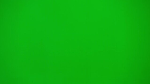 Portrait Of Man Medic On Chroma Key Green Screen. Close Up Side Profile Senior Doctor In Uniform Walking Through The Frame Looking Confident.